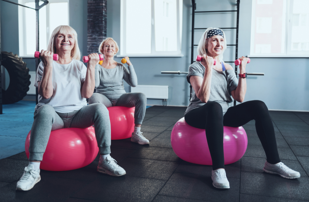 Older women doing exercises_Group Elderly exercise session_Physical IQ online fitness courses