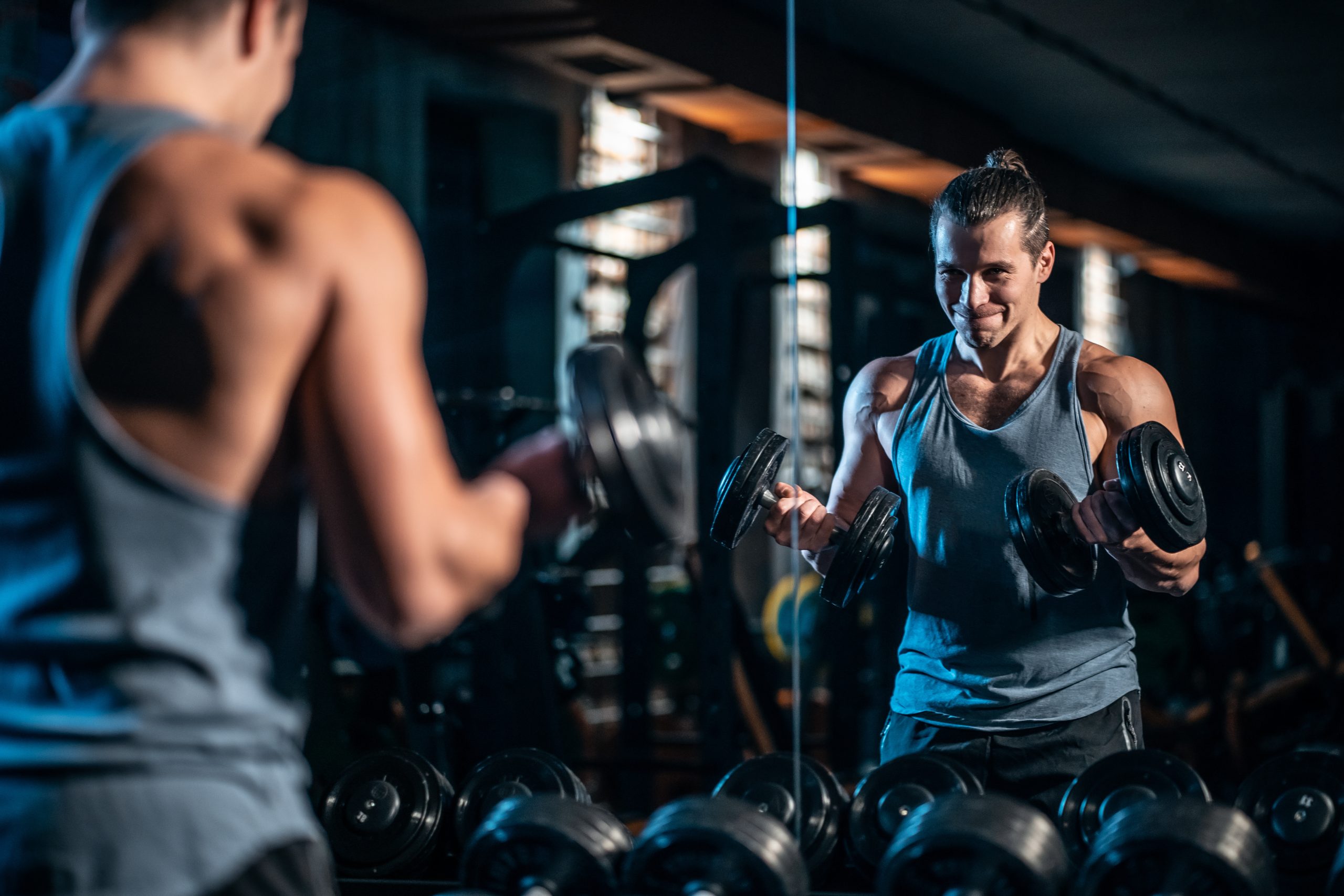 bodybuilder training in sport club with heavy weight